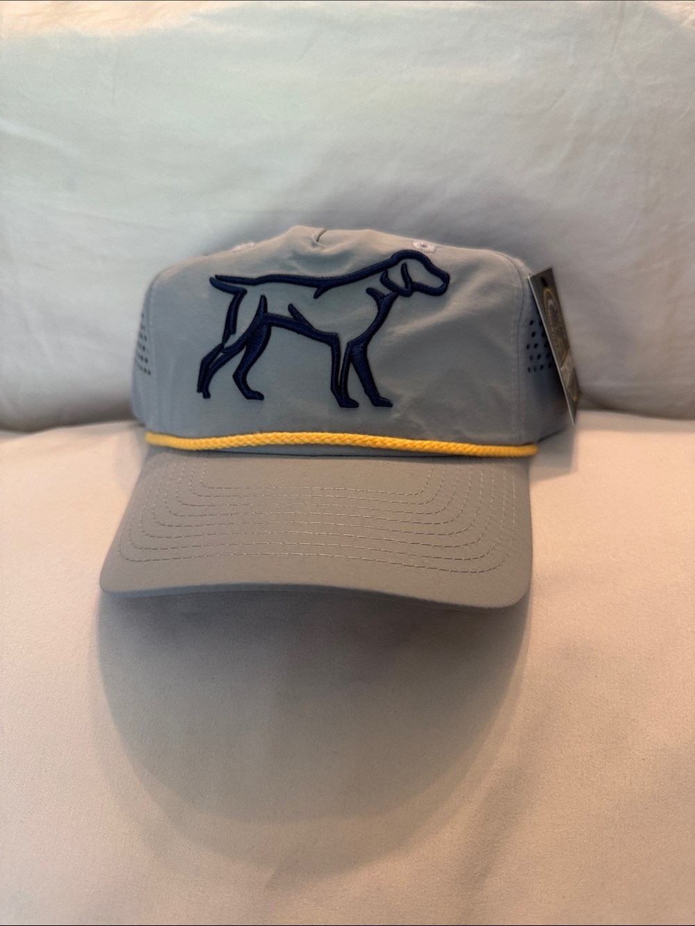 Light Gray Performance Cap with Navy Dog Outline and Yellow Accent